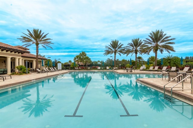 view of swimming pool with a patio area