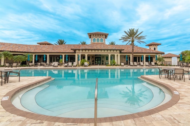 view of swimming pool featuring a patio area