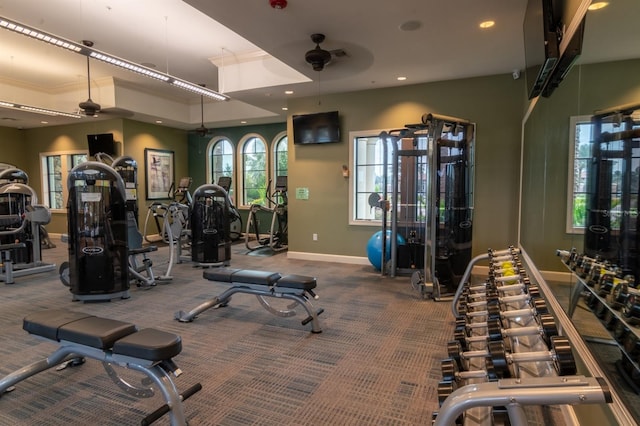 exercise room with ceiling fan and carpet floors