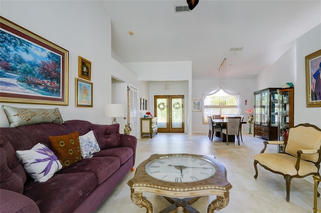 living room with light tile patterned floors and french doors