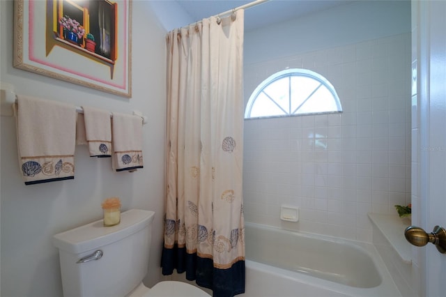 bathroom with shower / bath combo and toilet