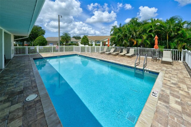 view of pool featuring a patio