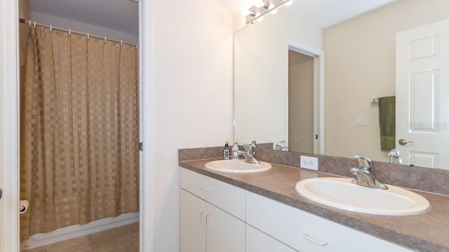 bathroom with tile patterned flooring, vanity, and shower / bath combo with shower curtain