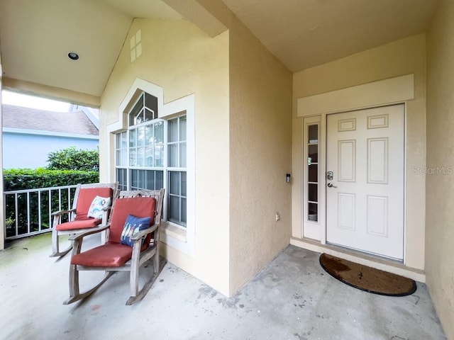 property entrance featuring a porch