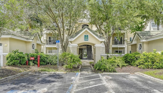 view of front of house featuring a balcony