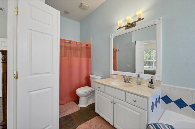 full bathroom featuring vanity, toilet, and independent shower and bath