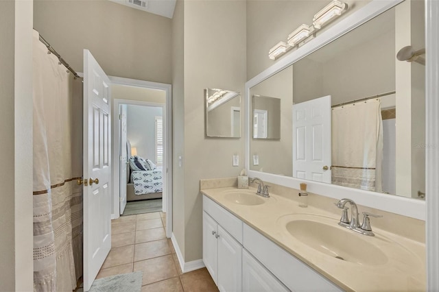 bathroom featuring a shower with curtain, tile patterned flooring, and vanity