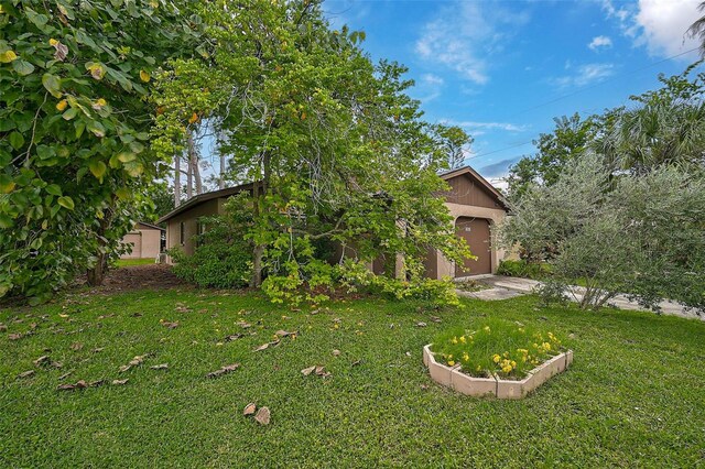 view of yard featuring a garage