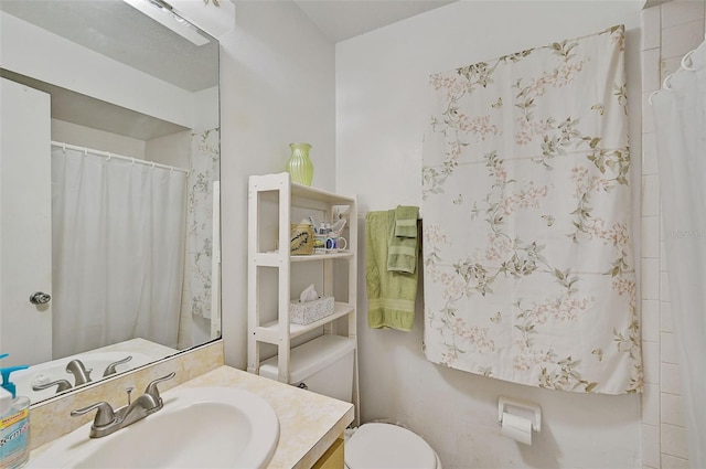 bathroom featuring vanity and toilet