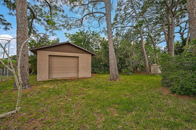 garage with a lawn