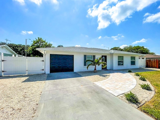 ranch-style home featuring a garage