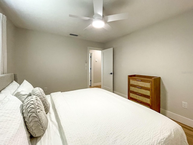 bedroom featuring hardwood / wood-style flooring and ceiling fan