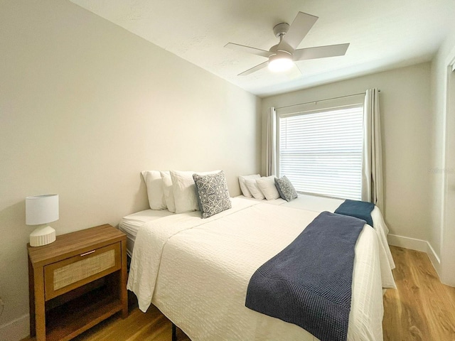 bedroom featuring hardwood / wood-style flooring and ceiling fan