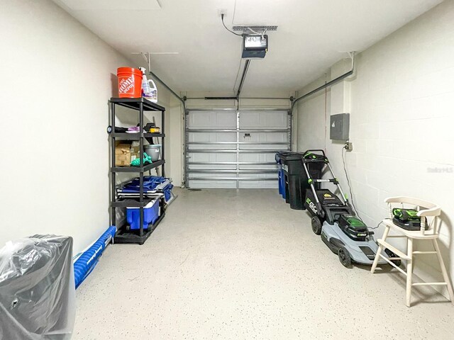 garage featuring a garage door opener and electric panel