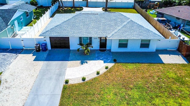 view of front of house featuring a front lawn and a patio