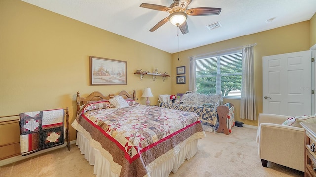 bedroom featuring light carpet and ceiling fan