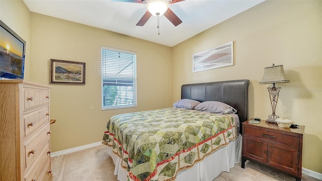 bedroom featuring light carpet and ceiling fan