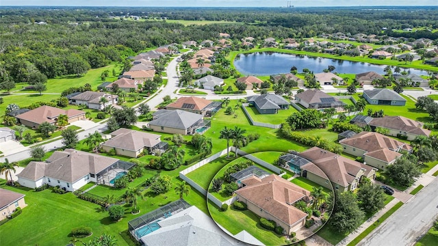 birds eye view of property with a water view