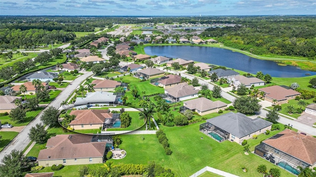 birds eye view of property featuring a water view