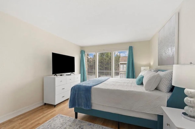 bedroom with light hardwood / wood-style floors