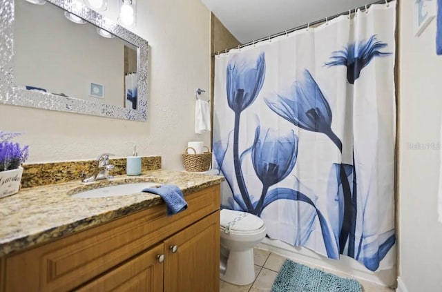 full bathroom with vanity, shower / tub combo with curtain, toilet, and tile patterned floors