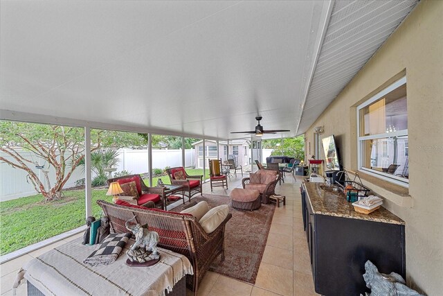 sunroom with ceiling fan and plenty of natural light