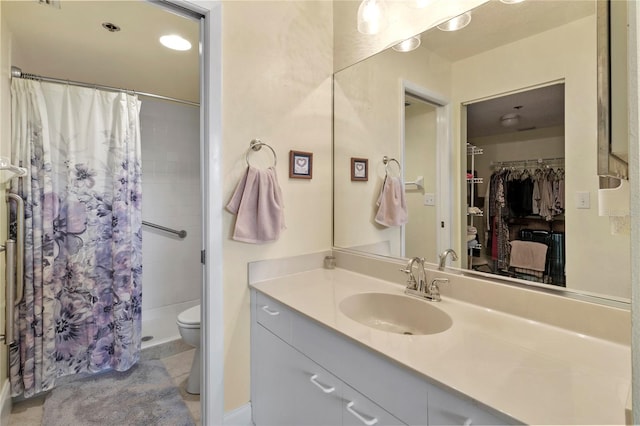 bathroom with vanity, a shower with curtain, and toilet