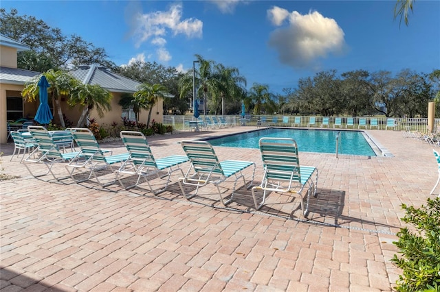 view of swimming pool featuring a patio area