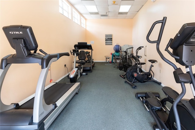 exercise room featuring a paneled ceiling