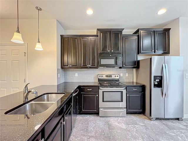 kitchen with decorative backsplash, stainless steel appliances, decorative light fixtures, and sink