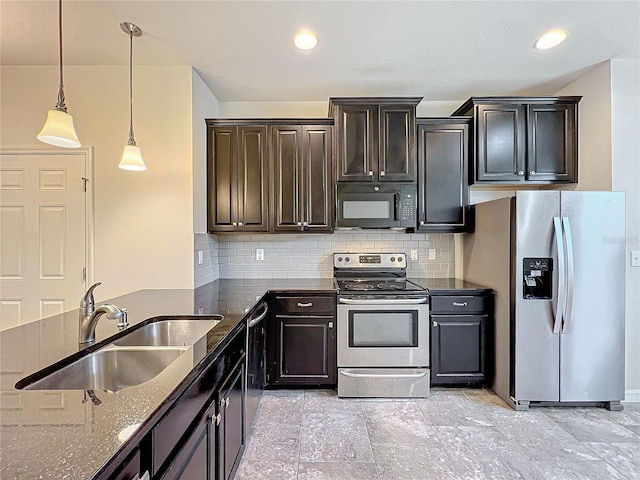 kitchen featuring backsplash, a sink, stainless steel appliances, and dark stone counters