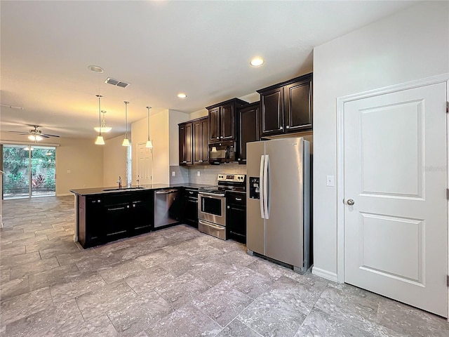 kitchen with stainless steel appliances, decorative backsplash, a sink, visible vents, and a peninsula