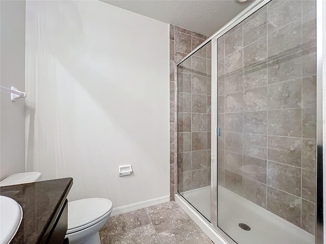 full bathroom with toilet, vanity, baseboards, and a shower stall