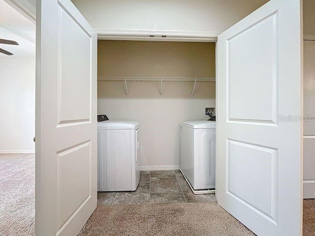 laundry area with baseboards, separate washer and dryer, ceiling fan, and laundry area