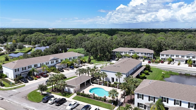 bird's eye view featuring a residential view and a view of trees