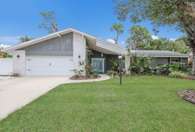 ranch-style home with a front lawn and a garage