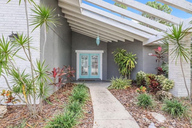 entrance to property featuring french doors