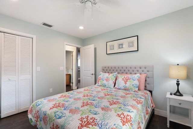 bedroom featuring ceiling fan, dark hardwood / wood-style floors, and a closet