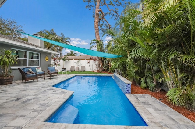 view of swimming pool with a patio