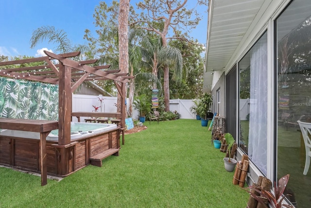 view of yard featuring a pergola and a hot tub