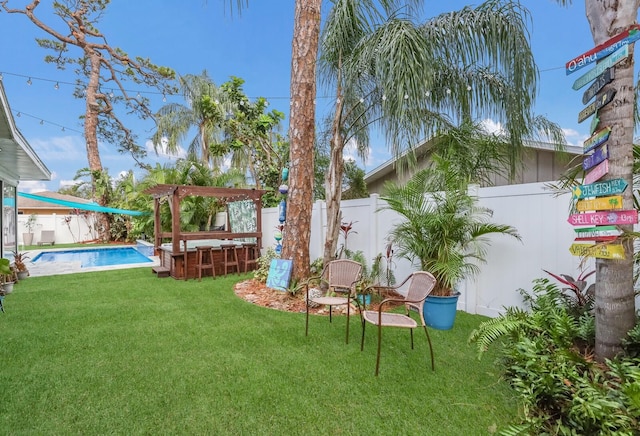 view of yard featuring a fenced in pool and a patio area