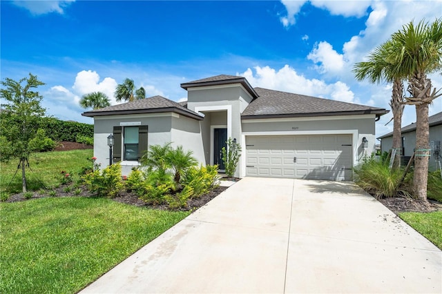 view of front of property featuring a garage and a front yard