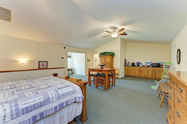 carpeted bedroom featuring lofted ceiling, ceiling fan, and a textured ceiling