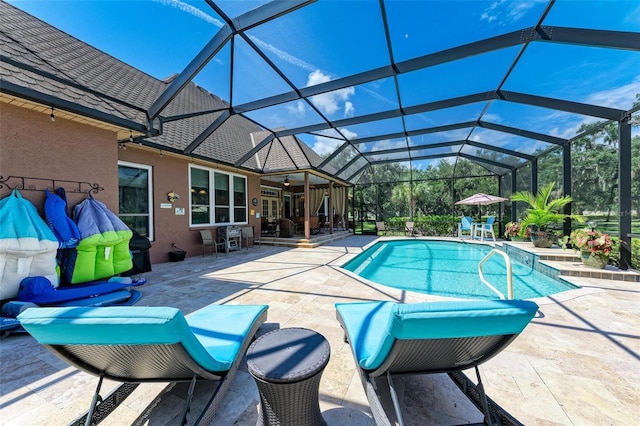 view of pool featuring a lanai and a patio area