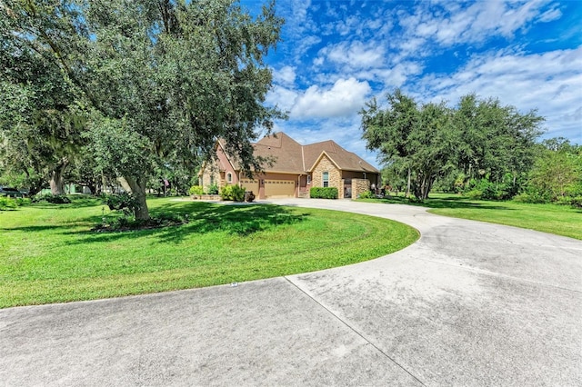 view of front of house featuring a garage and a front yard