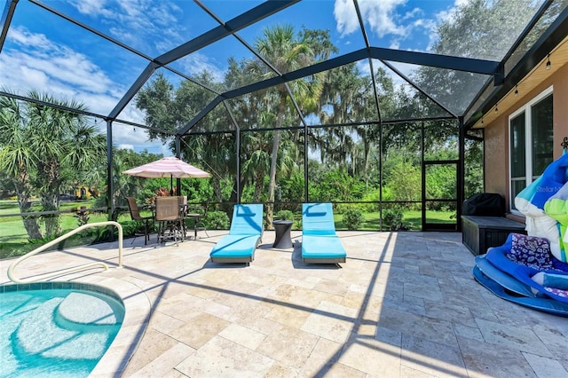 view of patio / terrace featuring glass enclosure and a grill