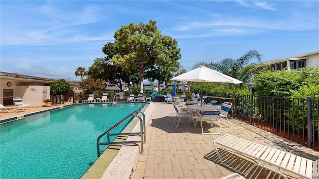 view of swimming pool with a patio