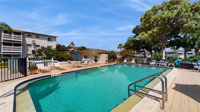 view of swimming pool with a patio area