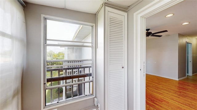 interior details with wood-type flooring and ceiling fan