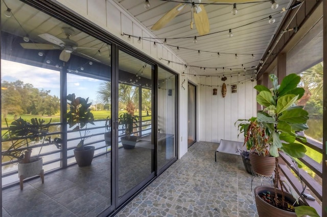 sunroom featuring ceiling fan